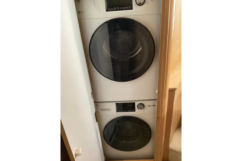 Slide: The Image of Stacked washer and dryer in 1997 Hatteras 70 Sport Deck Motor Yacht. - 37