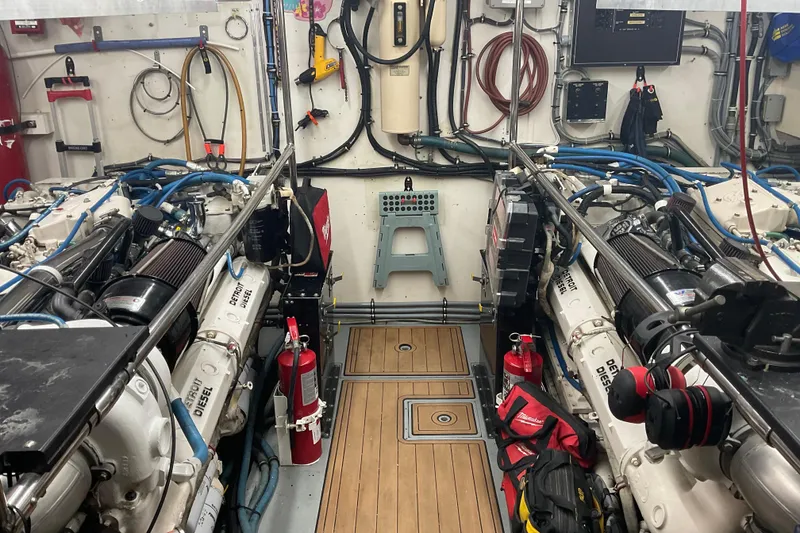 Slide: The Image of Engine room of a 1997 Hatteras 70 Sport Deck Motor Yacht, featuring Detroit Diesel engines. - 38