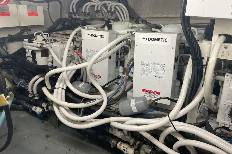 Slide: The Image of Engine room of 1997 Hatteras 70 Sport Deck Motor Yacht with Dometic equipment. - 43