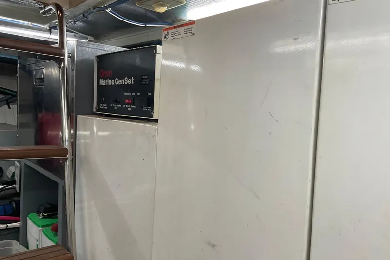 Slide: The Image of Engine room of 1997 Hatteras 70 Sport Deck Motor Yacht with Onan Marine GenSet. - 45