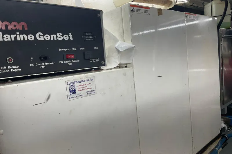 Slide: The Image of Marine generator system on a 1997 Hatteras 70 Sport Deck Motor Yacht. - 46