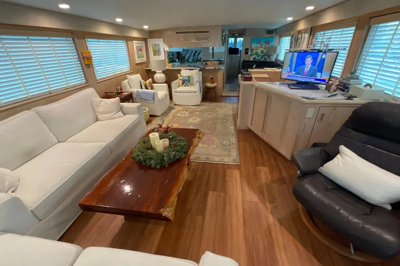 Slide: The Image of Luxurious interior of a 1997 Hatteras 70 Sport Deck Motor Yacht with elegant furnishings. - 8