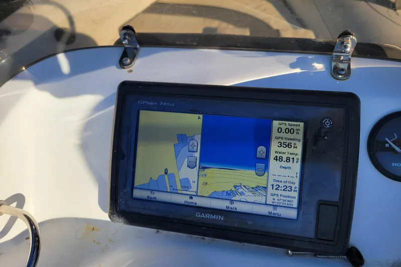 Slide: The Image of Garmin GPS display on 2018 Walker Bay Generation 400 DLX boat dashboard. - 12