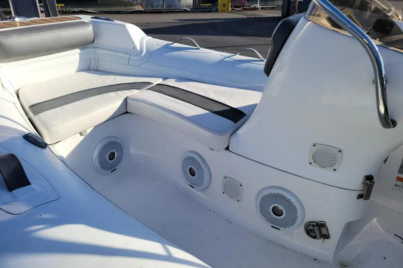 Slide: The Image of 2018 Walker Bay Generation 400 DLX boat interior with cushioned seating and built-in speakers. - 6