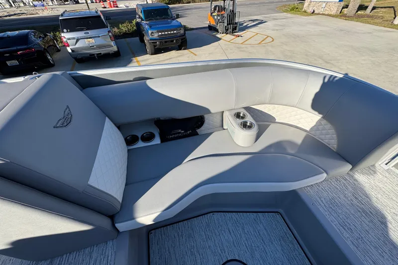 Slide: The Image of Luxurious seating on 2026 Bennington 23 LTFB pontoon boat with cup holders. - 18