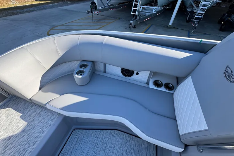 Slide: The Image of Luxurious seating on 2026 Bennington 23 LTFB boat with cup holders and quilted upholstery. - 19
