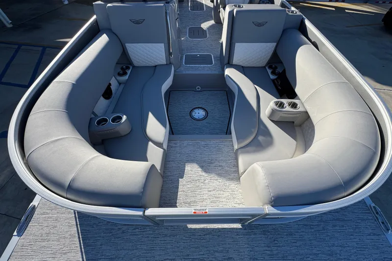 Slide: The Image of 2026 Bennington 23 LTFB pontoon boat interior with gray seating and cup holders. - 20