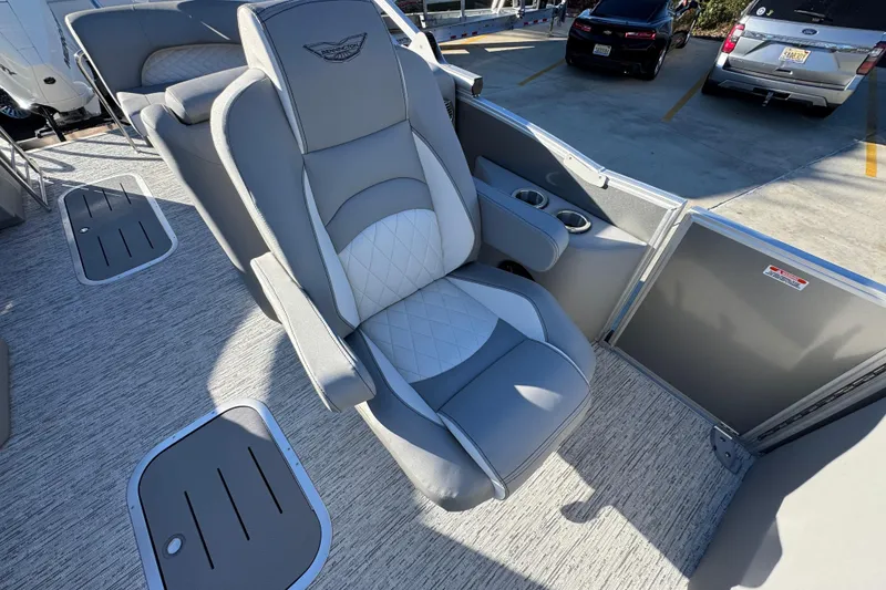 Slide: The Image of 2026 Bennington 23 LTFB boat interior with luxurious gray seating and cup holders. - 24