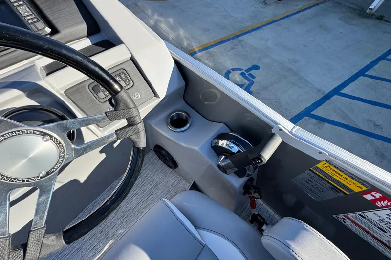 Slide: The Image of Steering wheel and controls of 2026 Bennington 23 LTFB boat, parked in accessible space. - 29