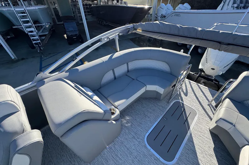 Slide: The Image of 2026 Bennington 23 LTFB pontoon boat interior with gray seating and flooring. - 32
