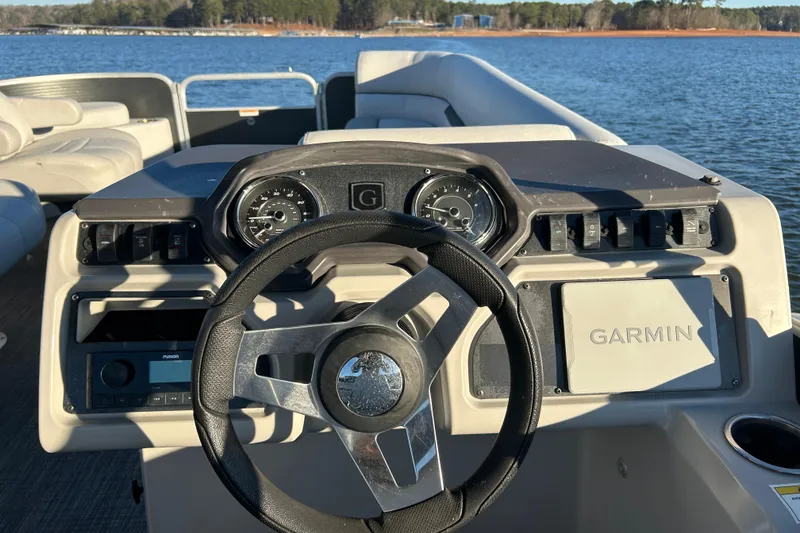 Slide: The Image of 2023 Godfrey Sweetwater 2286 C boat dashboard with Garmin navigation system. - 12