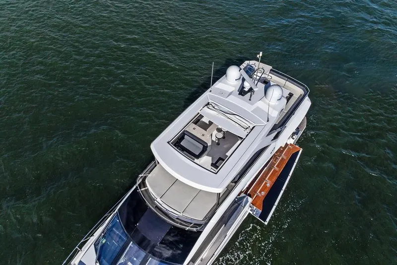 Slide: The Image of Aerial view of 2018 Galeon 640 Fly yacht cruising on open water. - 17
