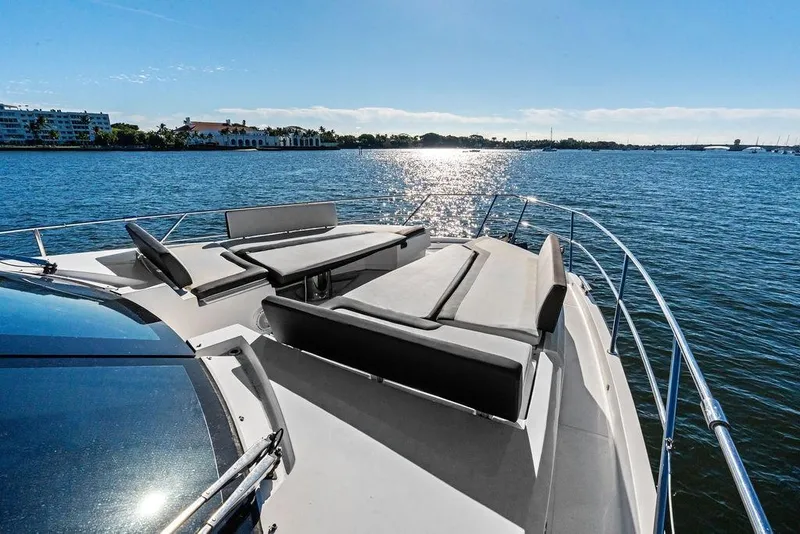 Slide: The Image of Galeon 640 Fly 2018 yacht with sun loungers on a sunny day, overlooking calm waters. - 20