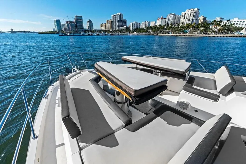Slide: The Image of Luxurious 2018 Galeon 640 Fly yacht with spacious deck, city skyline in background. - 21