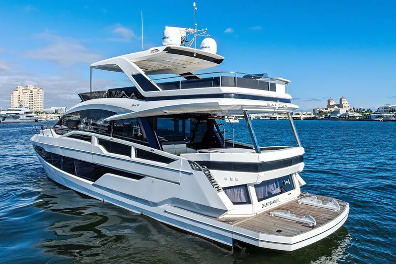 Slide: The Image of Luxurious 2018 Galeon 640 Fly yacht cruising in a scenic harbor setting. - 3