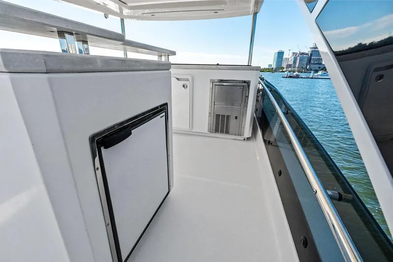 Slide: The Image of Galeon 640 Fly 2018 yacht deck with sleek design and waterfront view. - 34