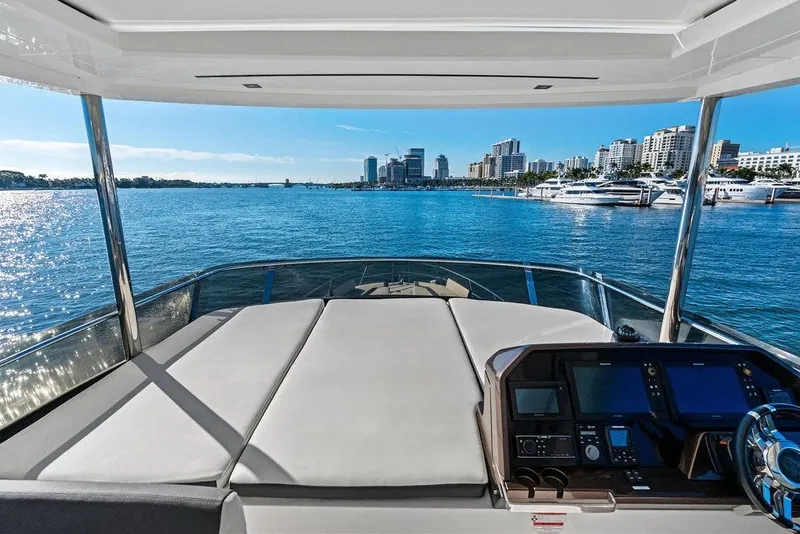 Slide: The Image of 2018 Galeon 640 Fly yacht interior with city skyline and marina view. - 35