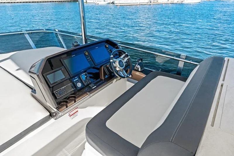 Slide: The Image of Cockpit of 2018 Galeon 640 Fly yacht with modern navigation equipment and steering wheel. - 37
