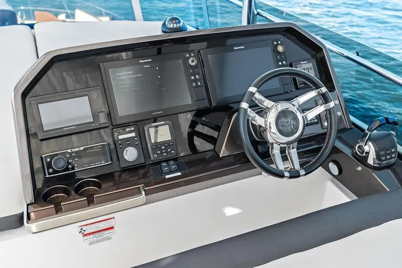 Slide: The Image of Helm station of 2018 Galeon 640 Fly yacht with advanced navigation controls. - 38