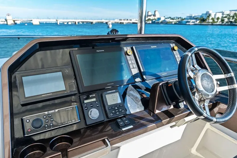 Slide: The Image of Cockpit of 2018 Galeon 640 Fly yacht with advanced navigation systems and steering wheel. - 39