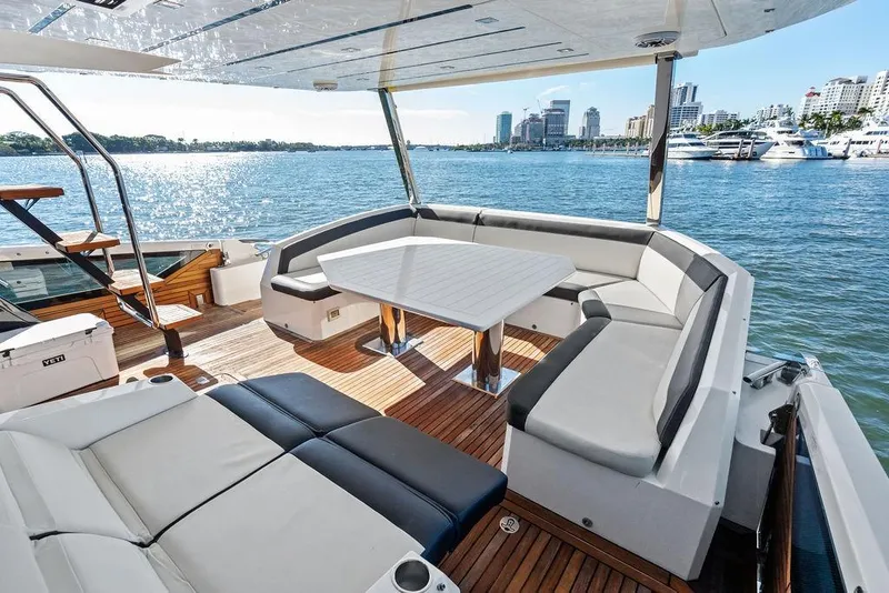 Slide: The Image of Luxurious 2018 Galeon 640 Fly yacht with elegant seating and scenic waterfront view. - 43