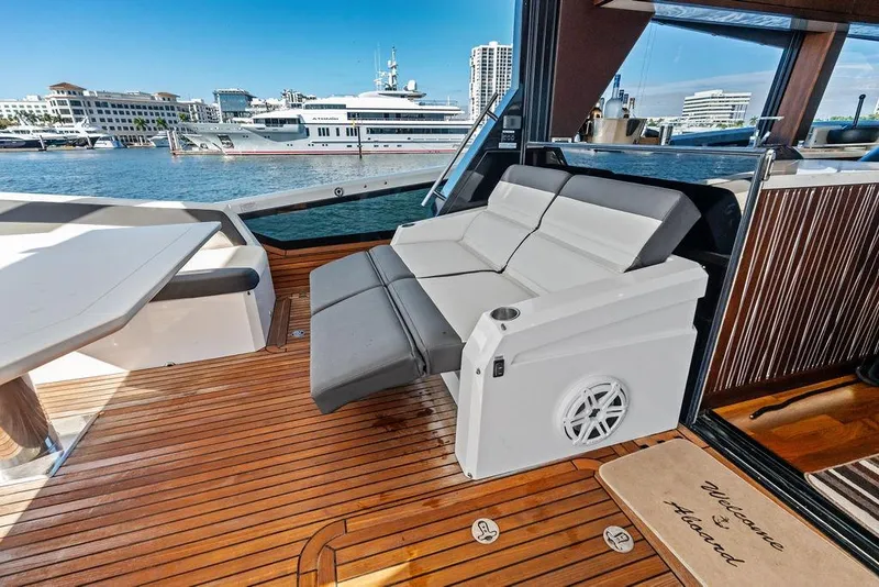 Slide: The Image of Luxurious 2018 Galeon 640 Fly yacht deck with comfortable seating and scenic marina view. - 45