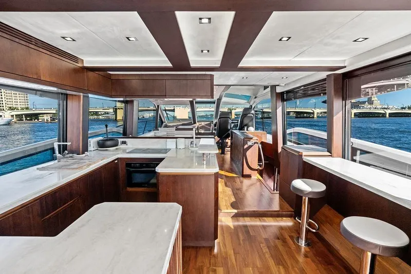 Slide: The Image of Luxurious interior of 2018 Galeon 640 Fly yacht with modern kitchen and panoramic windows. - 51