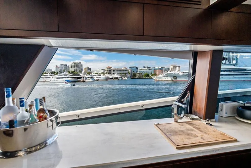 Slide: The Image of Luxurious view from 2018 Galeon 640 Fly yacht's kitchen, overlooking marina and cityscape. - 55