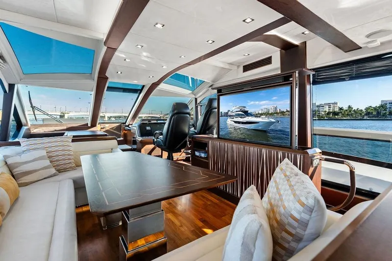 Slide: The Image of Luxurious interior of 2018 Galeon 640 Fly yacht with panoramic windows and elegant seating. - 58