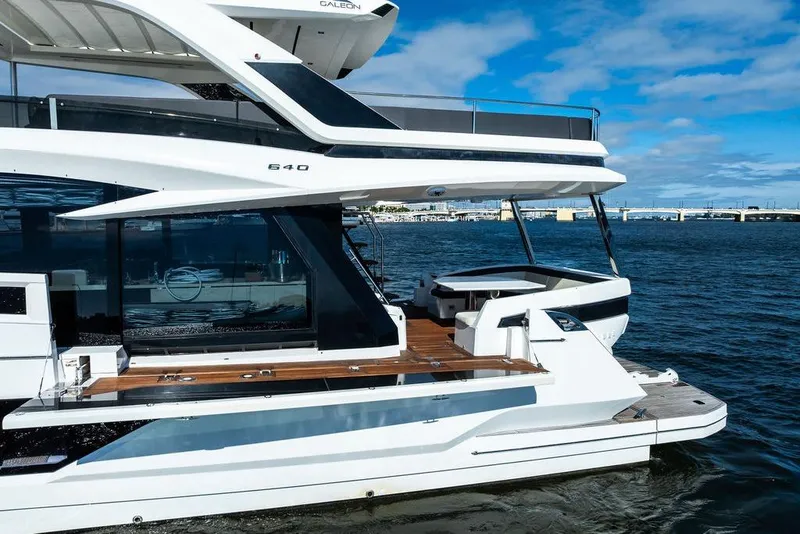 Slide: The Image of Luxurious 2018 Galeon 640 Fly yacht cruising on open water under a clear blue sky. - 6