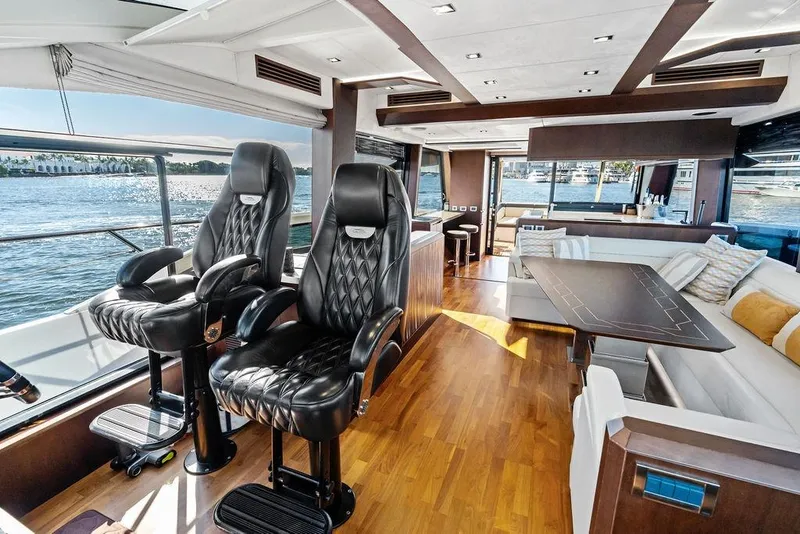 Slide: The Image of Luxurious interior of 2018 Galeon 640 Fly yacht with leather seating and scenic water views. - 62