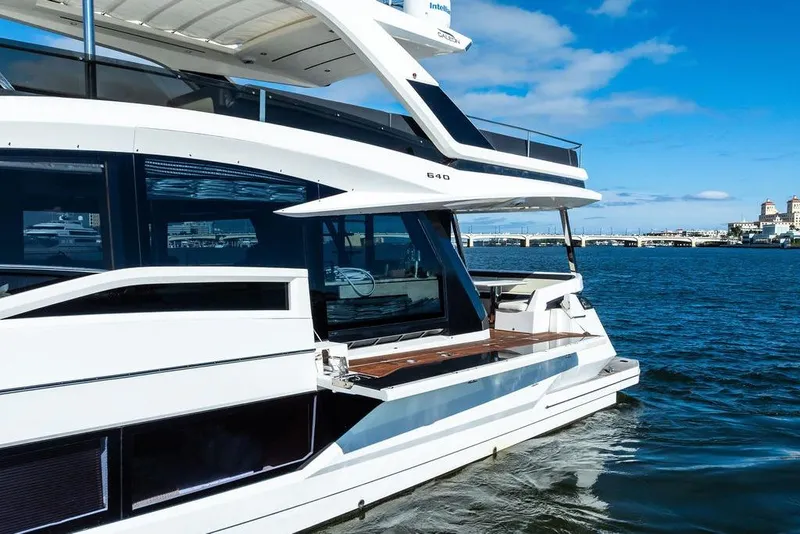 Slide: The Image of 2018 Galeon 640 Fly yacht cruising on a sunny day, showcasing sleek design and luxury. - 7