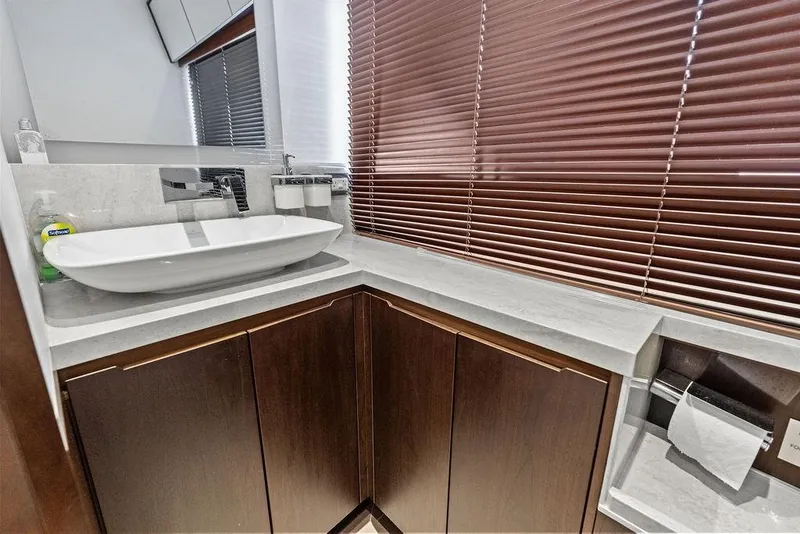 Slide: The Image of Luxurious bathroom in 2018 Galeon 640 Fly yacht with modern sink and wooden cabinets. - 83