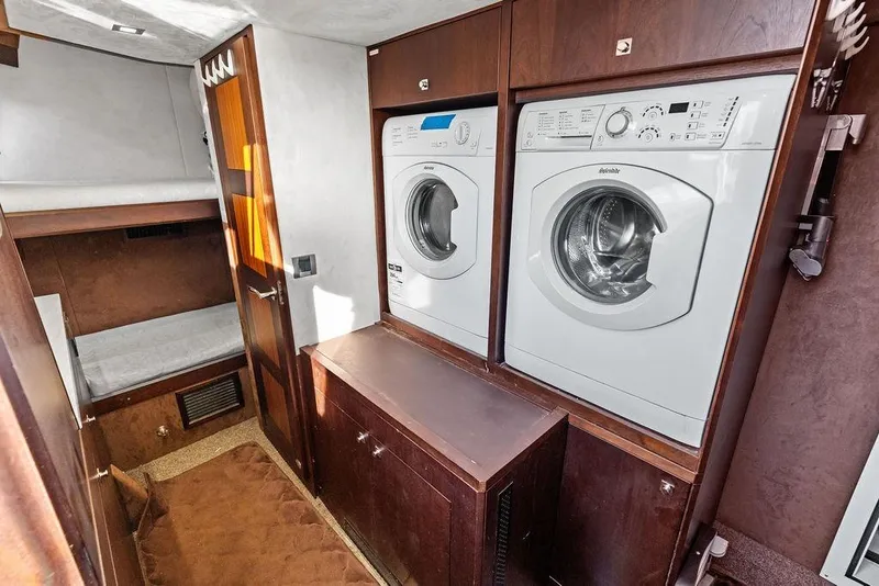 Slide: The Image of Laundry area with washer and dryer on 2018 Galeon 640 Fly yacht. - 87