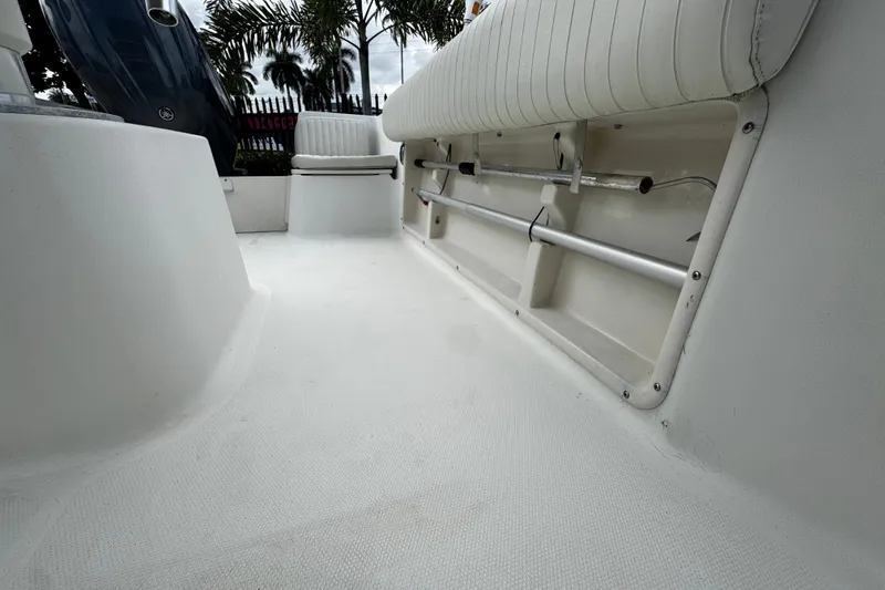 Slide: The Image of 2023 Hydra-Sports 212 CC boat interior with white seating and storage compartments. - 19