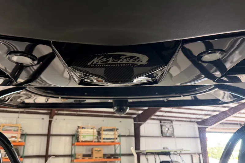 Slide: The Image of 2025 Nor-Tech 390 Sport Center Console boat detail in a storage facility. - 15