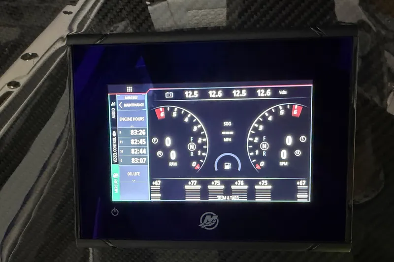 Slide: The Image of Dashboard display of 2025 Nor-Tech 390 Sport Center Console boat, showing engine metrics. - 17