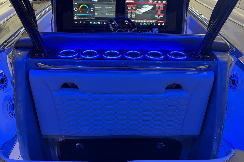 Slide: The Image of 2025 Nor-Tech 390 Sport Center Console with illuminated dashboard and modern controls. - 18