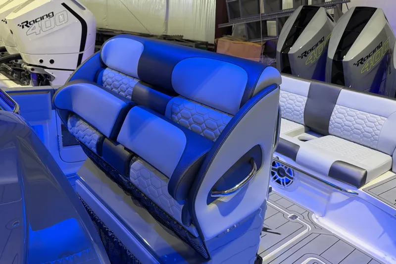Slide: The Image of 2025 Nor-Tech 390 Sport Center Console interior with stylish seating and powerful Racing 400 engines. - 22