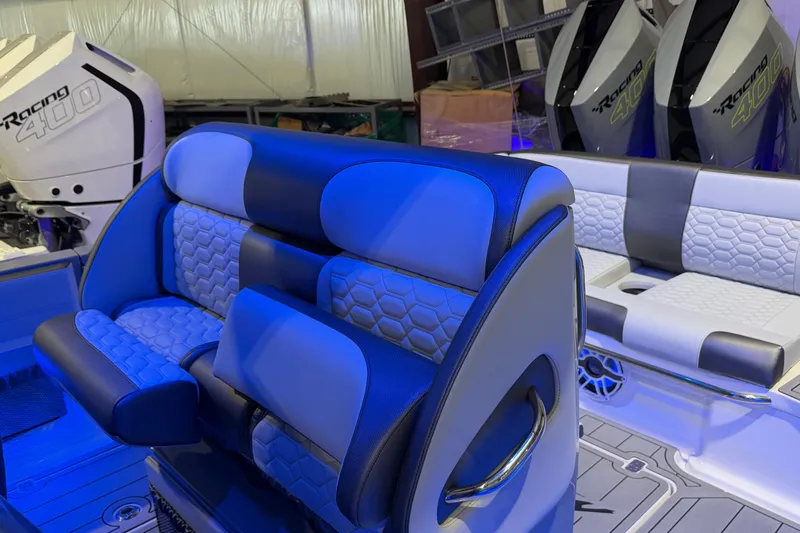 Slide: The Image of 2025 Nor-Tech 390 Sport Center Console with luxurious seating and powerful Racing 400 engines. - 23