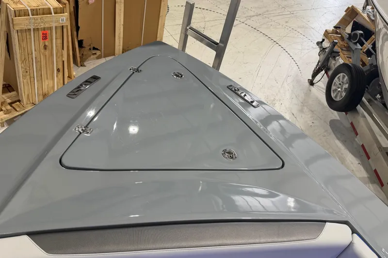 Slide: The Image of 2025 Nor-Tech 390 Sport Center Console boat deck in a showroom setting. - 30