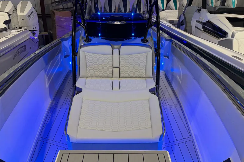 Slide: The Image of 2025 Nor-Tech 390 Sport Center Console with illuminated seating and sleek design. - 31