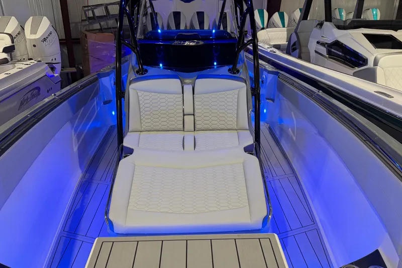 Slide: The Image of 2025 Nor-Tech 390 Sport Center Console with illuminated seating and sleek design. - 36