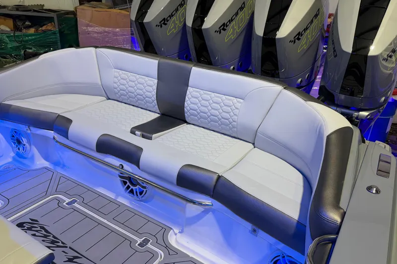 Slide: The Image of 2025 Nor-Tech 390 Sport Center Console with luxurious seating and powerful outboard engines. - 40