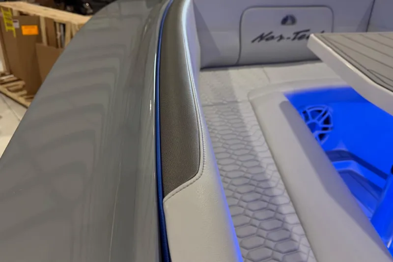 Slide: The Image of 2025 Nor-Tech 390 Sport Center Console interior with blue LED lighting and sleek design. - 42