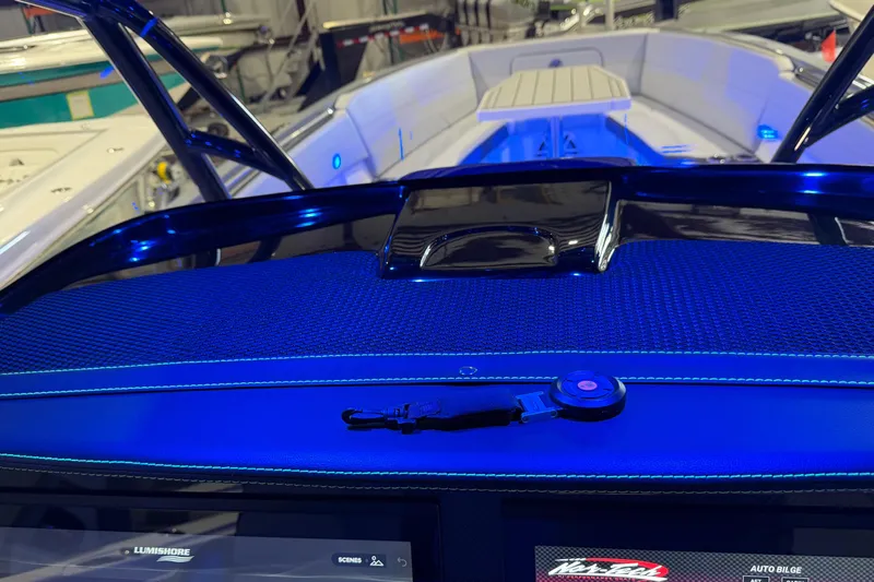 Slide: The Image of 2025 Nor-Tech 390 Sport Center Console dashboard with blue ambient lighting. - 43