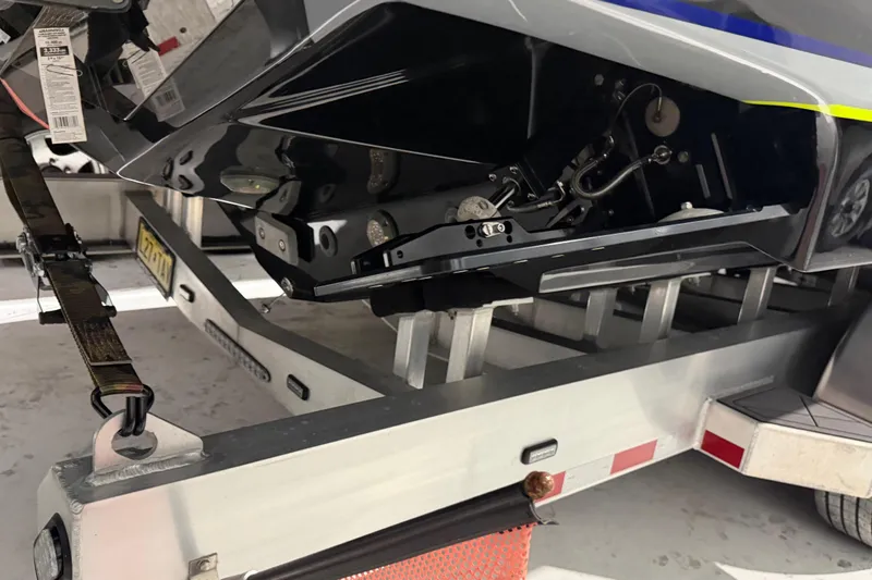 Slide: The Image of 2025 Nor-Tech 390 Sport Center Console on trailer, detailed view of hull and components. - 46