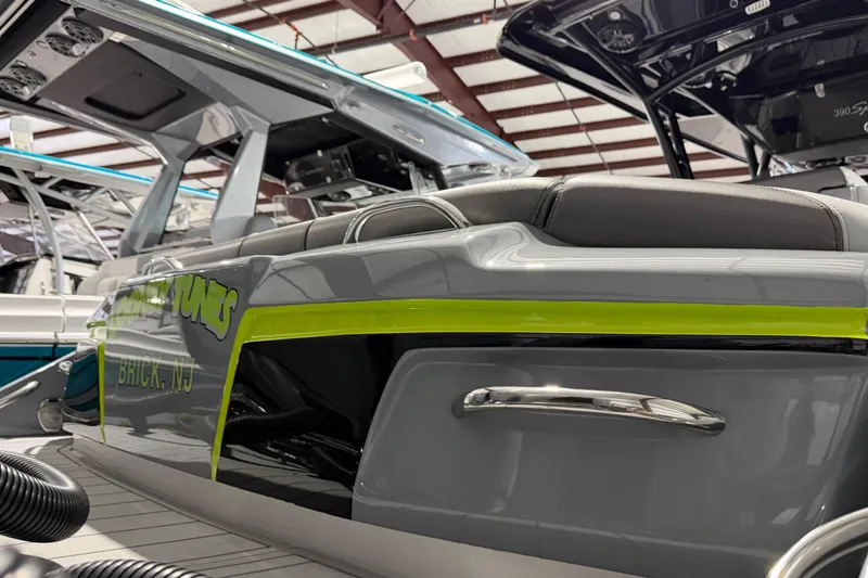 Slide: The Image of 2025 Nor-Tech 390 Sport Center Console boat in showroom, featuring sleek design and modern detailing. - 51