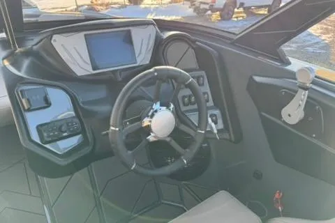 Slide: The Image of 2026 Supreme S220 boat dashboard with steering wheel and digital display. - 10
