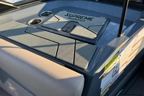Slide: The Image of 2026 Supreme S220 boat dashboard with cup holders and sleek design. - 12